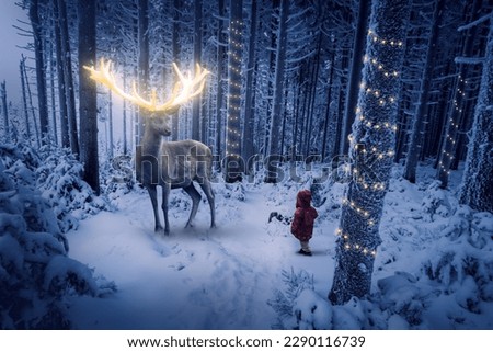 Imaginative large stag with golden antlers stands in a snow-covered forest