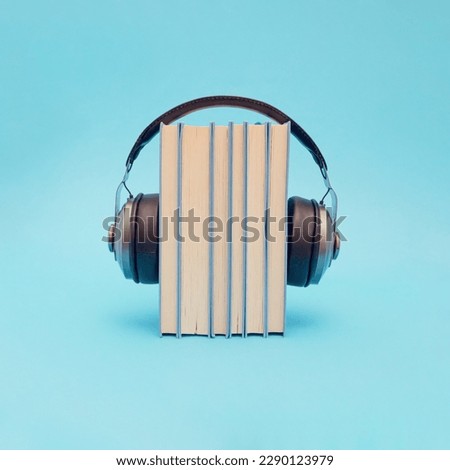 Books with retro headphones. Headset with digital online books stack, idea of podcast listening or electronic learning and study, education, audio books concept.