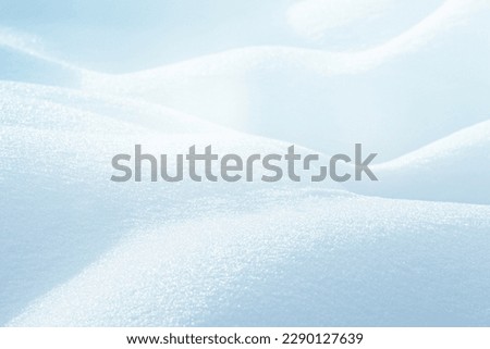 LIGHT BLUE SNOW BACKGROUND, NATURAL CHRISTMAS BACKDROP WITH SNOWY HILLS IN SUN LIGHT