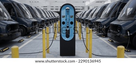 MED shot of fleet modern electric EV delivery vans are being charged in company parking garage Royalty-Free Stock Photo #2290136945