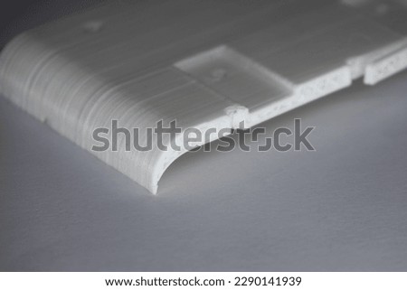 A white pla 3d printed part with infill isolated on white