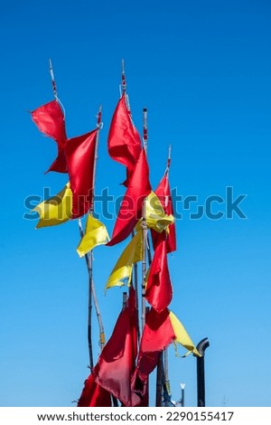 Colored (mostly red) flags from fishing nets