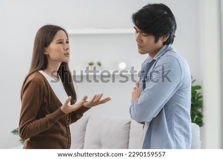 Family problems, Asian couple quarrel together at home. woman angry on man and man feel annoy. Royalty-Free Stock Photo #2290159557