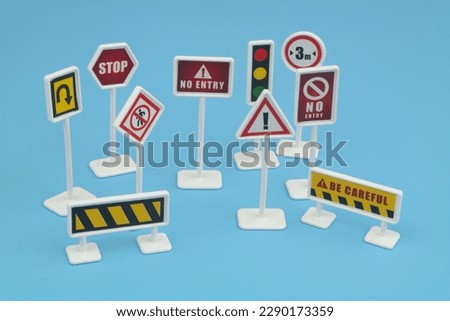 Close up of traffic signs on blue background.