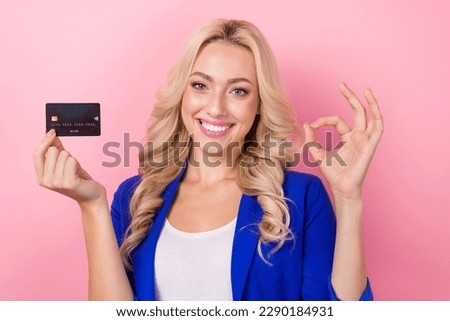 Photo of professional seo manager young beautiful lady smile show okey symbol hold plastic debit card good offer isolated on pink color background
