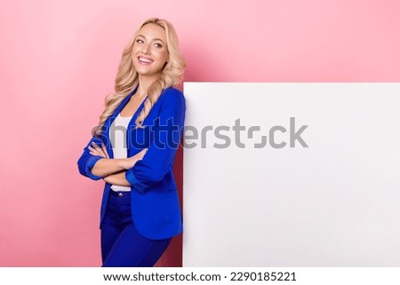 Photo of sweet confident woman dressed blue blazer looking white placard empty space isolated pink color background
