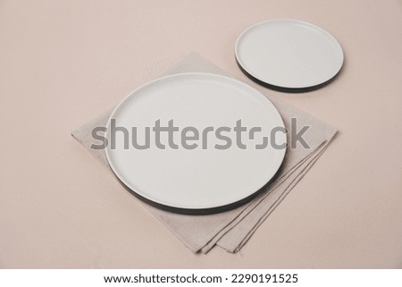 white plate mockup on beige background. top view.