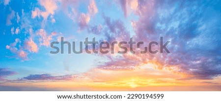 Magnificent sunset sky panorama.View of  Sunset  Sunrise Sundown Sky with colorful clouds, long panorama, crop it. Without any birds Royalty-Free Stock Photo #2290194599