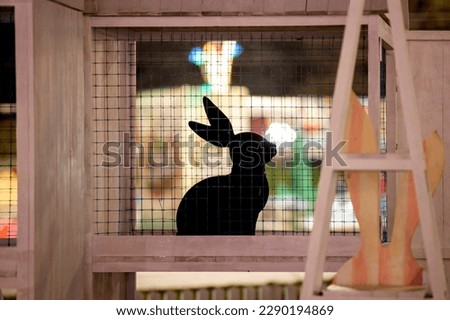 A cartoon bunny with Easter lighting in background pictured during preparation to Orthodox Easter celebration in front of Cathedral of Christ's Nativity.