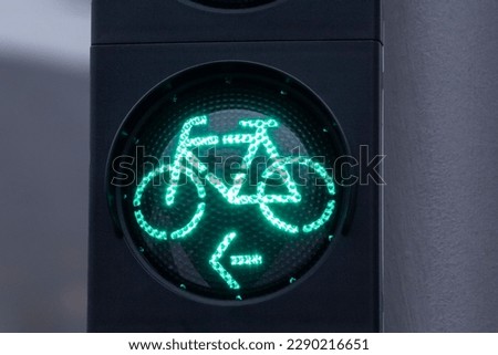 European green lights for bicicle lane. Traffic light for bikers