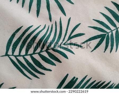 portrait of a cloth with a palm leaf pattern,Tropical leaves pattern palm plants. Green leaf monstera seamless.