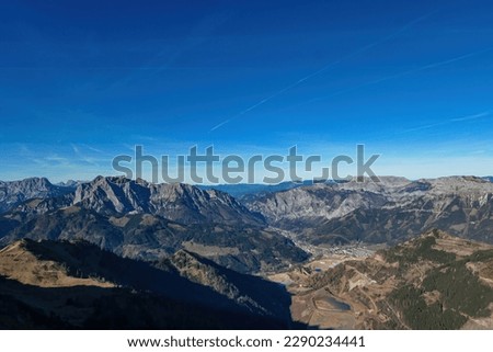 Aerial view from mount Eisenerzer Reichenstein in Styria, Austria, Europe. Austrian Alps. View on the village Eisenerz and lakes in the Ennstal valley. Hiking trail, Wanderlust. Sunny day in autumn