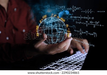 Physics scientist holds a globe to study laws of gravitational force with a computer from stars in solar system that affect our planet and phenomena such as sea level or heat waves from solar storms. Royalty-Free Stock Photo #2290234861