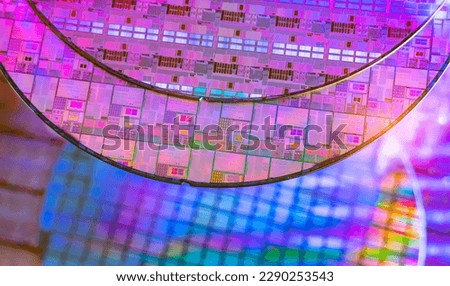 Silicon Wafers with microchips used in electronics for the fabrication of integrated circuits Royalty-Free Stock Photo #2290253543