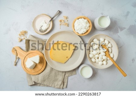 Dairy products on bright background. Top view from above Royalty-Free Stock Photo #2290263817