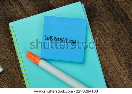 Concept of Subrogation write on sticky notes isolated on Wooden Table.