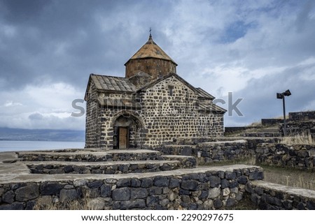Monastery complex under dramatic spring sky photo. Ancient church near Lake Sevan concept photo. High quality picture for wallpaper