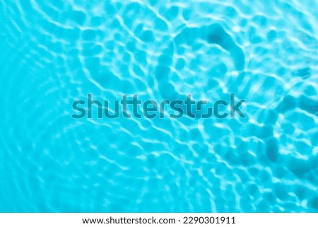 Water surface texture, blue background.
