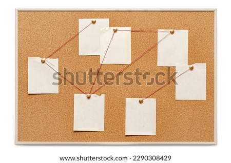 Blank paper notes are pinned to a cork board. The concept of detective investigation. Copy space. Royalty-Free Stock Photo #2290308429