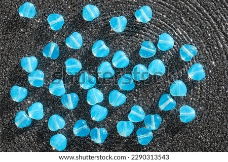 Czech blue glass beads in the form of hearts.