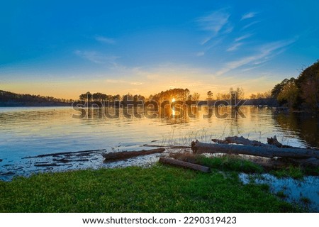Beautiful sunset on Beaver Lake near Rogers Arkansas. Royalty-Free Stock Photo #2290319423