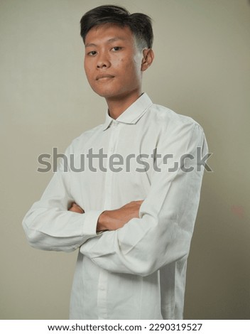 asian man in white with flat face