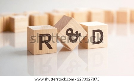word R and D made with wood building blocks, stock image. background may have blur effect Royalty-Free Stock Photo #2290327875