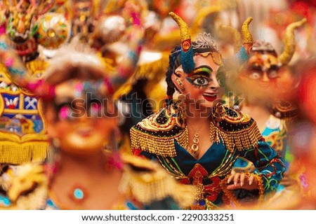 ORURO, BOLIVIA: Dancers at Oruro Carnival in Bolivia. Religious, folkloric and cultural festival declared as a "Masterpiece of the Oral and Intangible Heritage of Humanity" (Unesco) in 2001. Royalty-Free Stock Photo #2290333251