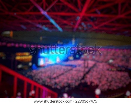 Defocused blurred photo of the atmosphere of blackpink's concert in Jakarta, Born in Pink. The ambience of pink lights dominated, very crowded, exciting and fun. Royalty-Free Stock Photo #2290367475