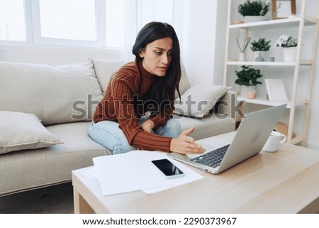 Woman working from home freelance in laptop online, overwork and fall depression from lack of vitamins