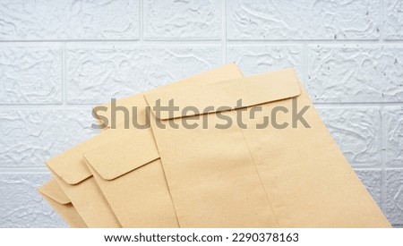 Woman Hand showing Indonesian Money Rupiah on envelope