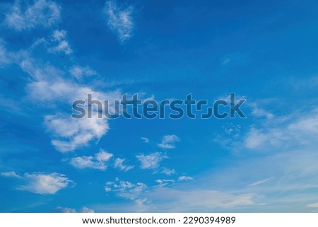 Beautiful view of blue sky with clouds at sunrise. Partly cloudy.Background cloud summer. Cloud summer. Sky cloud clear with sunset. Natural sky cinematic beautiful yellow and white texture background Royalty-Free Stock Photo #2290394989