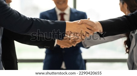 Image two business partner meeting successful handshake together with success join congratulation good deal contract in modern office.Partnership approval and teamwork concept