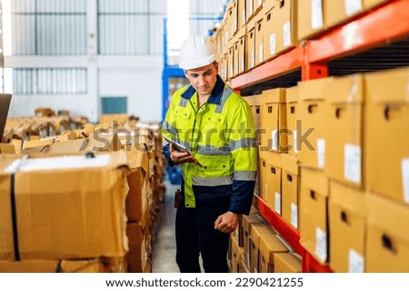 Portrait engineer worker labor man use tablet shipping order detail check goods and supplies on shelves with goods background inventory in factory warehouse.logistic industry and business export
