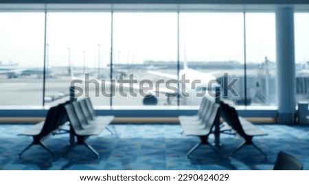 BLURRED OFFICE BACKGROUND, MODERN BUSINESS HALL WITH LIGHT REFLECTONS ON THE FLOOR,abstract blur in airport for background. Royalty-Free Stock Photo #2290424029