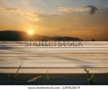 Wooden board on table with shadows, display podium for product mockups trade show display advertising, Natural blurred defocused background 