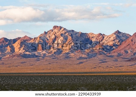 Geologic stratum visible in chocolate brown mountains in the Mojave Desert near Death Valley Junction, California Royalty-Free Stock Photo #2290433939