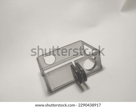 Selective Focus on Hard Case Action Camera, Universal, transparent black in color, able to protect the camera from impact, white background