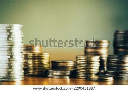 close-up of coins stack for a financial business background presentation, home loan, cash flow, money saving, stock and fund investing, money management, and retirement plan concept, selective focus Royalty-Free Stock Photo #2290451887