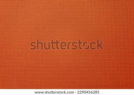 Orange ripstop nylon fabric used for bags and clothing Royalty-Free Stock Photo #2290456285