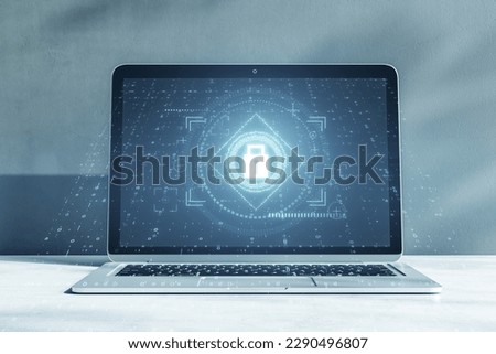 Close up of laptop with glowing padlock interface on concrete wall background. Safety, security and protection concept. 3D Rendering