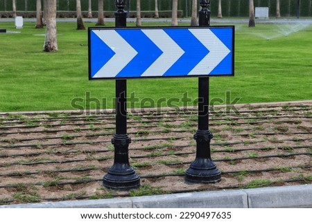 Blu,e and white chevron road sign,right curve symbol,road sign,trafic sign