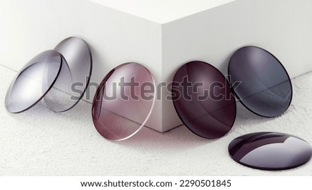 Lenses of glasses, sunglasses lenses of various colors, glass optical lenses taken separately, brochure pictures Royalty-Free Stock Photo #2290501845