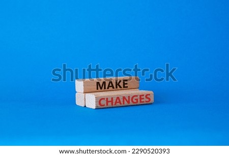 Make changes symbol. Wooden blocks with words Make changes. Beautiful blue background. Business and Make changes concept. Copy space.