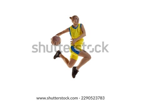Match preparation. Young sportive girl, basketball player in motion, training, playing against white studio background. Concept of professional sport, hobby, healthy lifestyle, action and motion