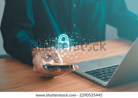 Data Security system concept, Business man is logging into system by mobile phone and  touch security icon, innovation technology, cloud computing, internet network communication Royalty-Free Stock Photo #2290535445