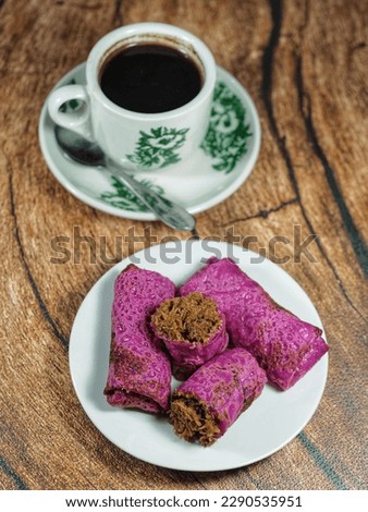 snacks whose skin is made of dragon fruit batter filled with grated coconut and palm sugar.