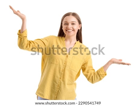 Young woman balancing on white background