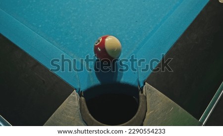 Pool Ball Falling into Pocket