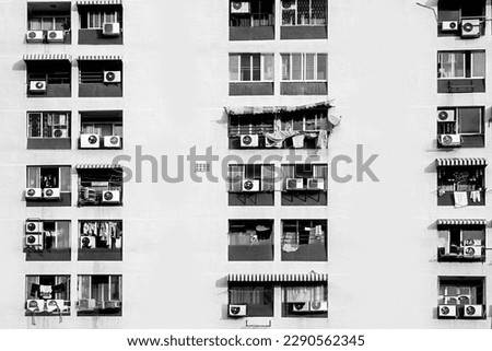housíng area with outside cooling with identical balcony architecture of a multi family skyscraper in Bangkok
